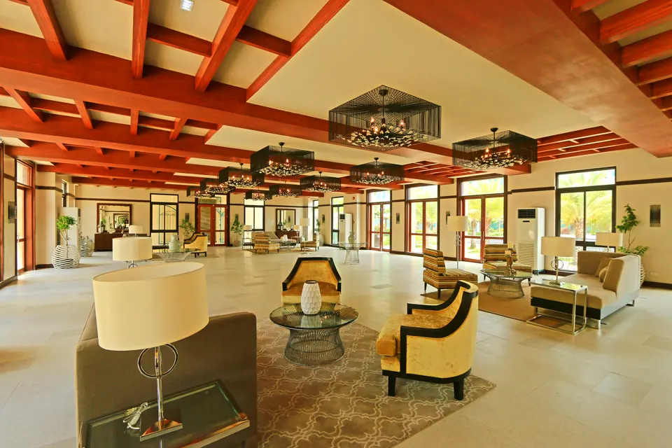 Amalfi clubhouse lobby with warm wood ceiling and lounge seating