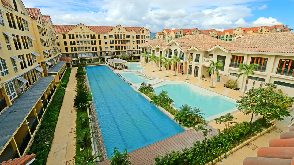 Amalfi at City di Mare central courtyard with long resort pool and Italian-inspired mid-rise residences