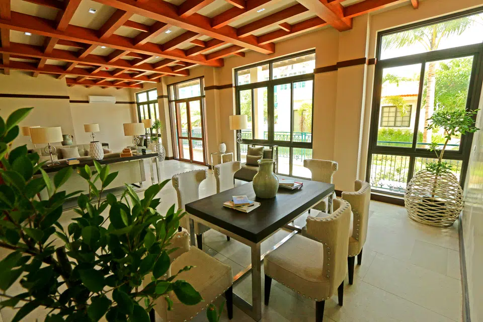 Amalfi indoor lounge with tables, seating and landscaped views
